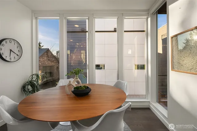 a view of a dining room with furniture window and wooden floor