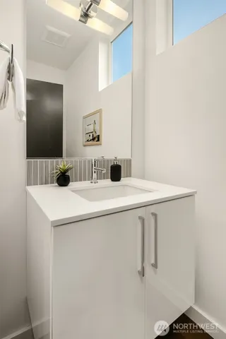 a bathroom with a sink and mirror