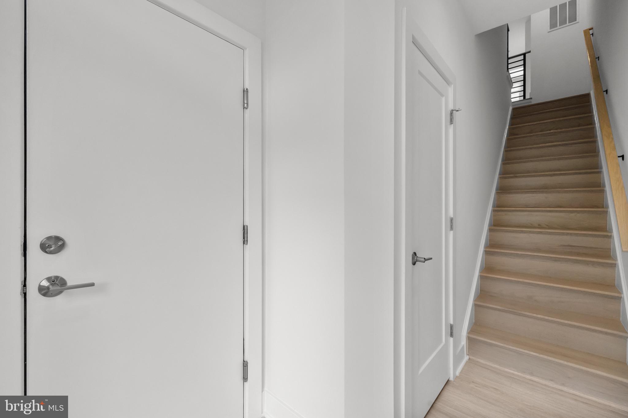 1891 Midline Avenue Reston, VA 20190 - Photo 12 of 53 a view of a hallway with wooden floor and entryway