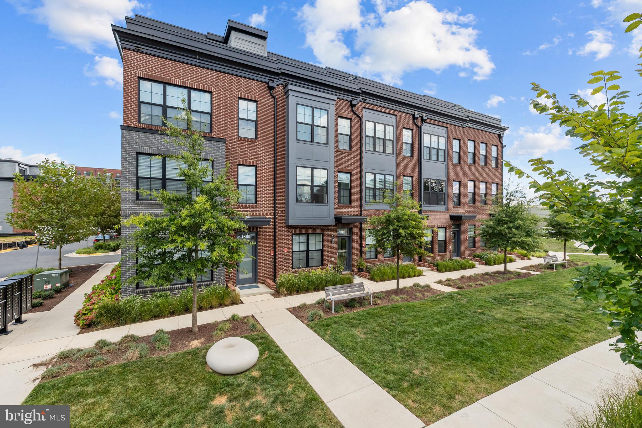 1891 Midline Avenue Reston, VA 20190 - Photo 2 of 53 a view of a brick building next to a yard