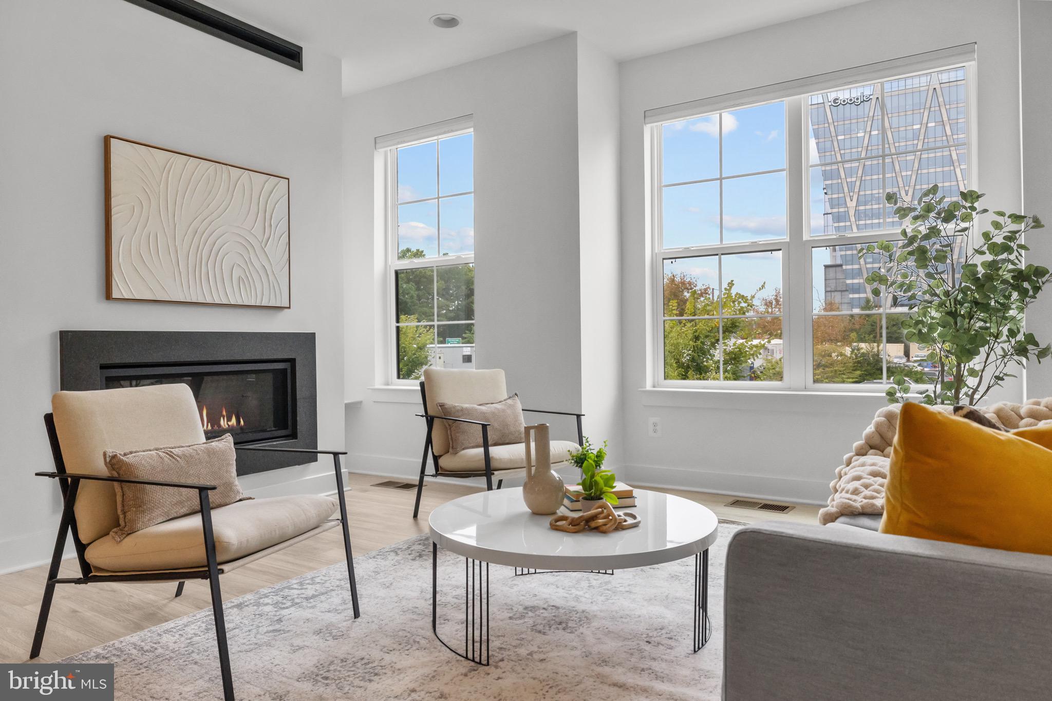 1891 Midline Avenue Reston, VA 20190 - Photo 22 of 53 a living room with furniture and a fireplace