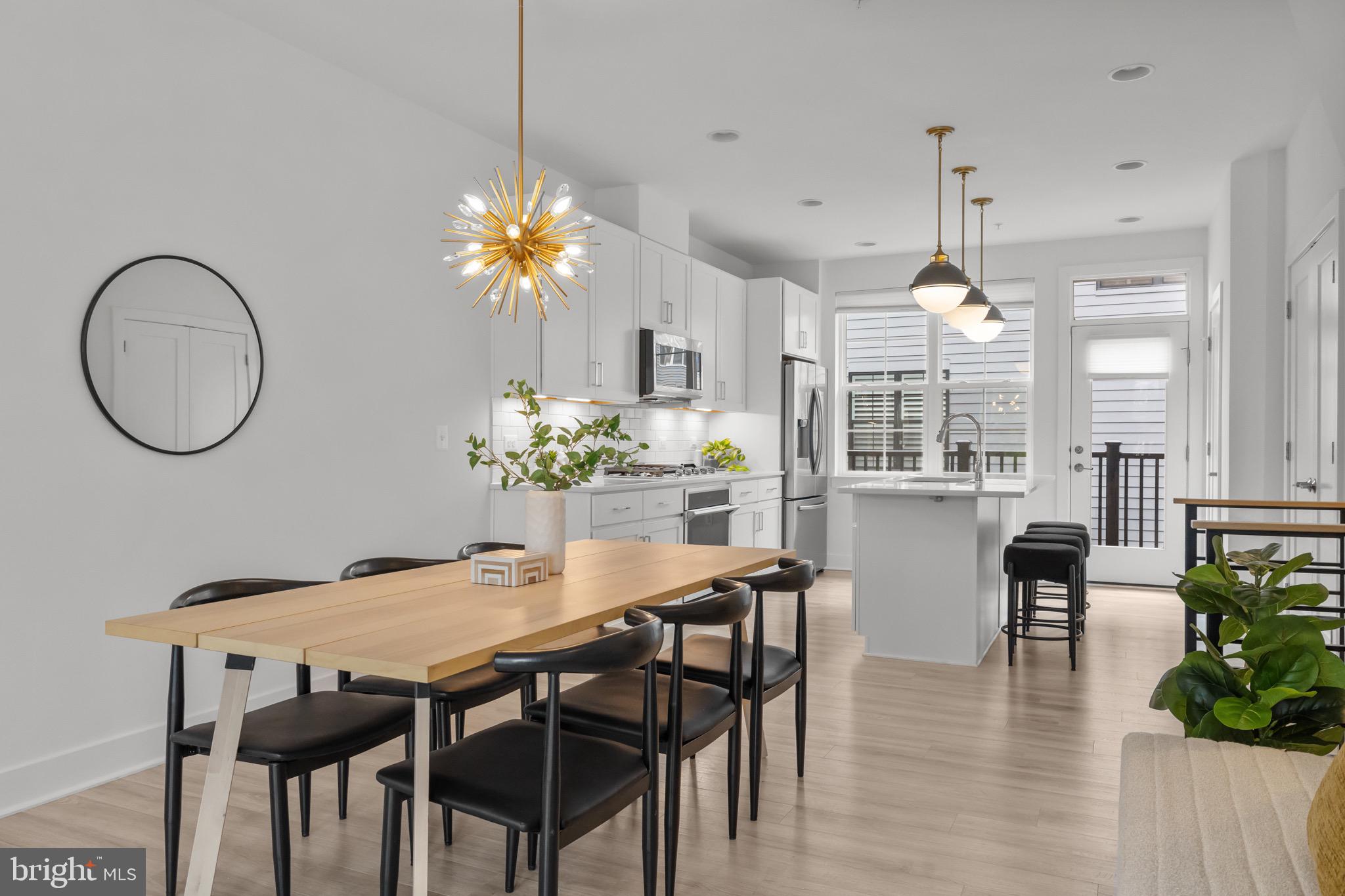 1891 Midline Avenue Reston, VA 20190 - Photo 23 of 53 a dining room with furniture potted plants and wooden floor