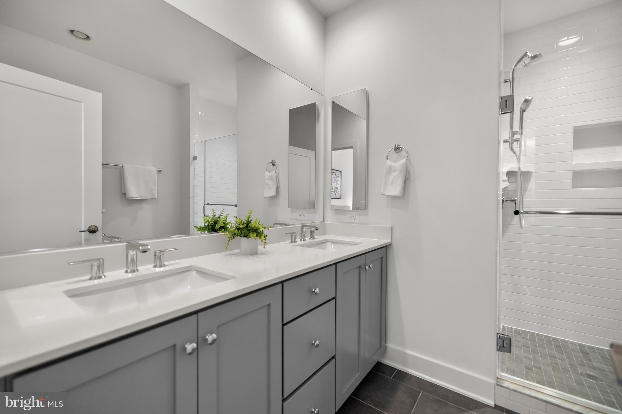 1891 Midline Avenue Reston, VA 20190 - Photo 29 of 53 a bathroom with a double vanity sink and mirror