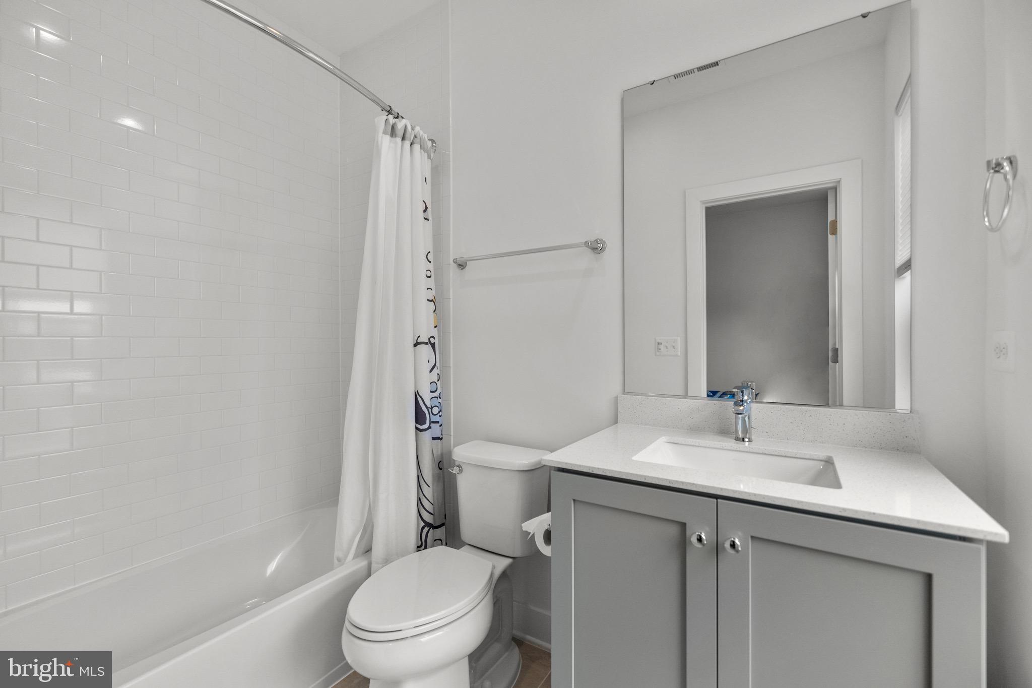1891 Midline Avenue Reston, VA 20190 - Photo 34 of 53 a bathroom with a granite countertop sink toilet and shower
