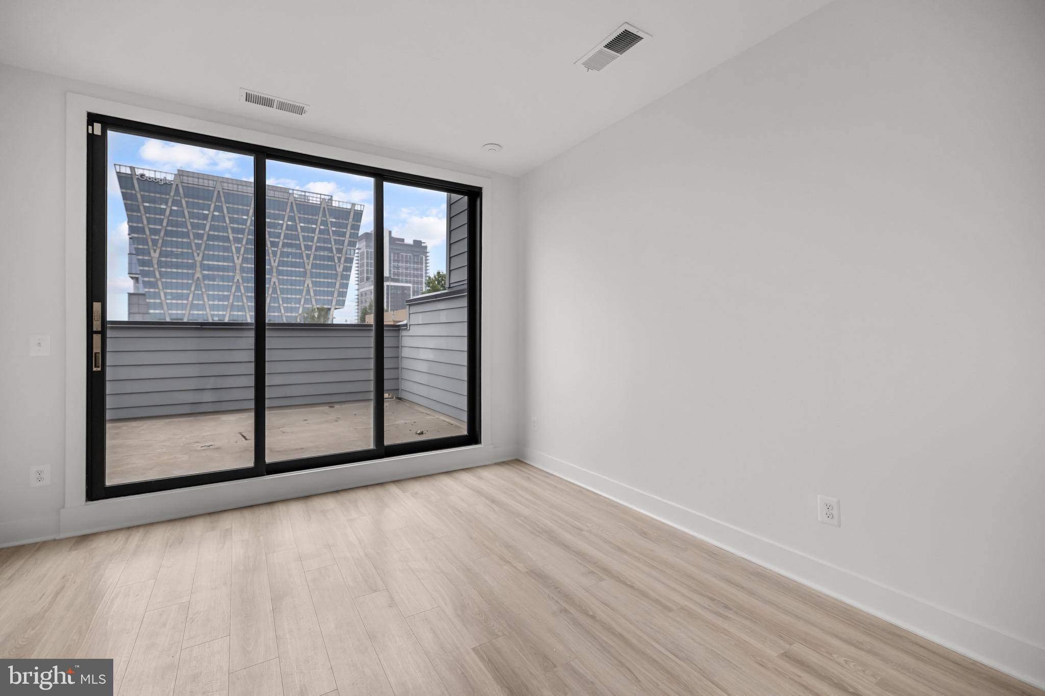 1891 Midline Avenue Reston, VA 20190 - Photo 38 of 53 a view of a room with wooden floor and a window