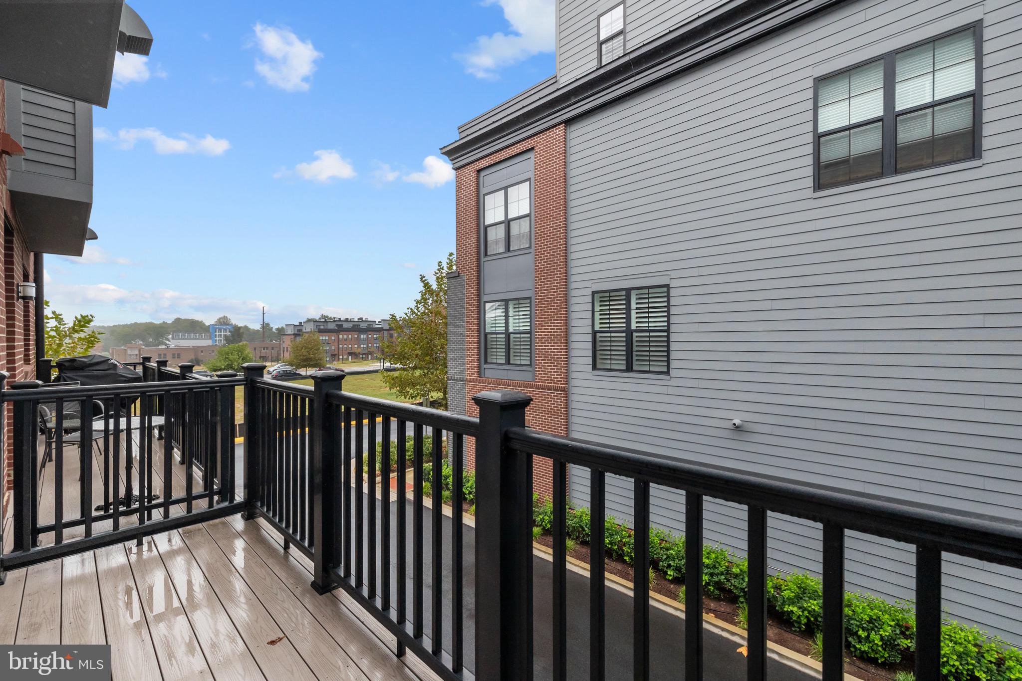 1891 Midline Avenue Reston, VA 20190 - Photo 42 of 53 a view of a wooden deck with large windows
