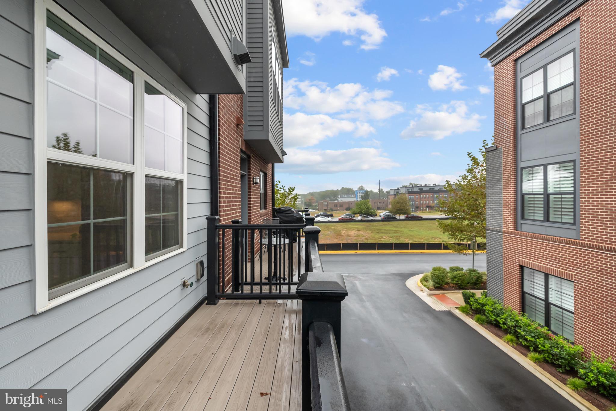 1891 Midline Avenue Reston, VA 20190 - Photo 44 of 53 a view of roof deck with seating space and wooden floor
