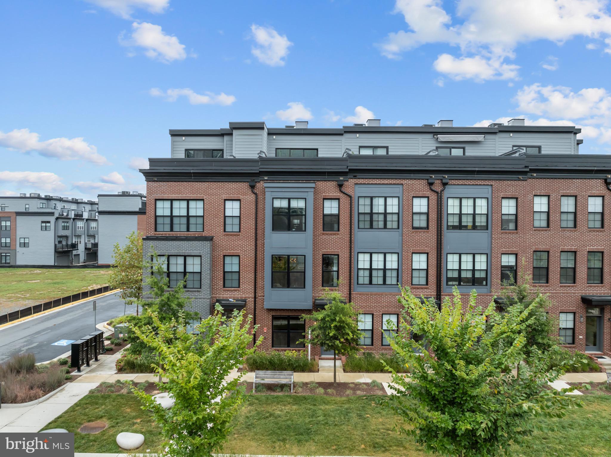 1891 Midline Avenue Reston, VA 20190 - Photo 48 of 53 a view of a city that has tall buildings and a big yard