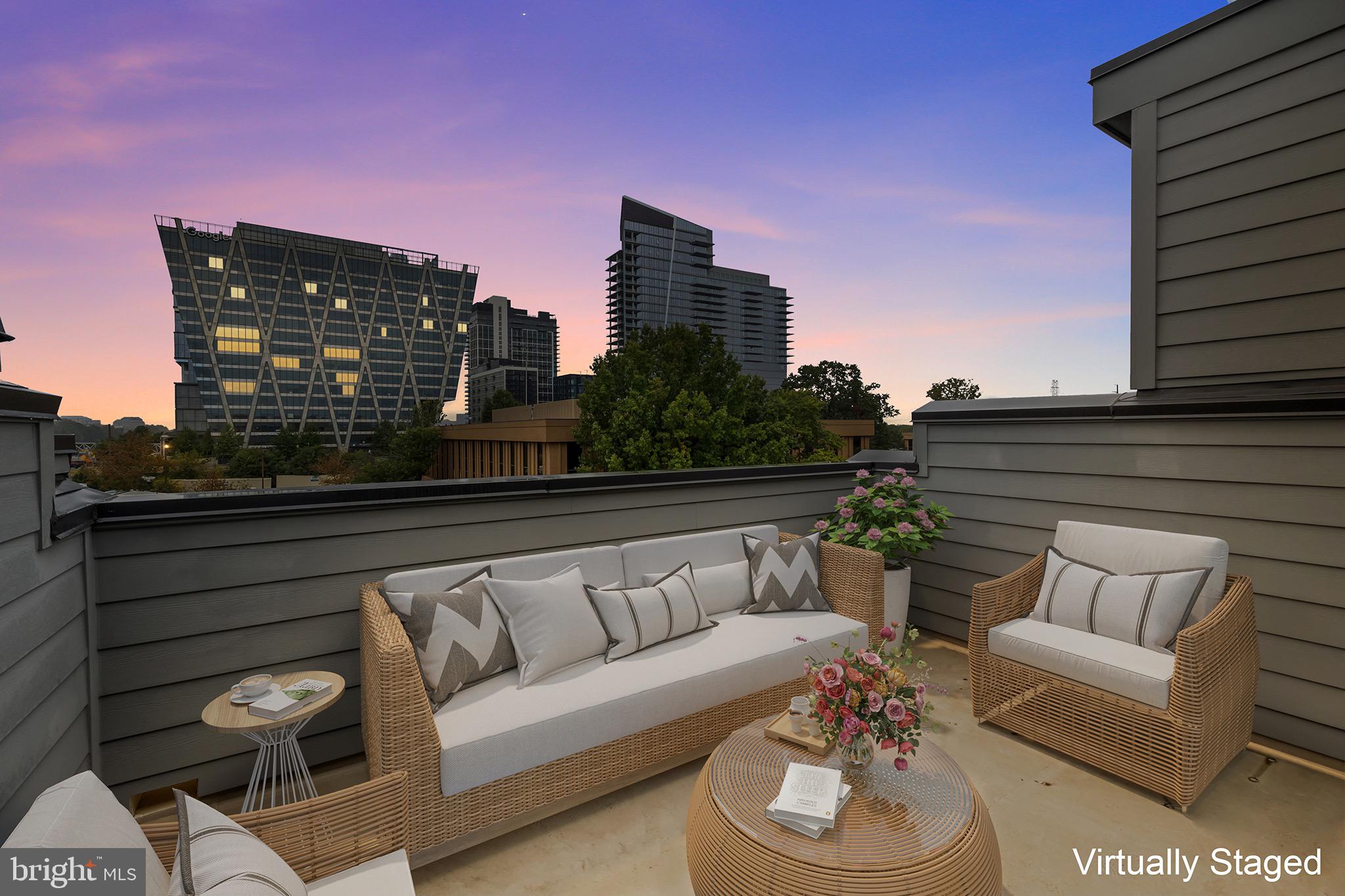 1891 Midline Avenue Reston, VA 20190 - Photo 7 of 53 a roof deck with couches and potted plants