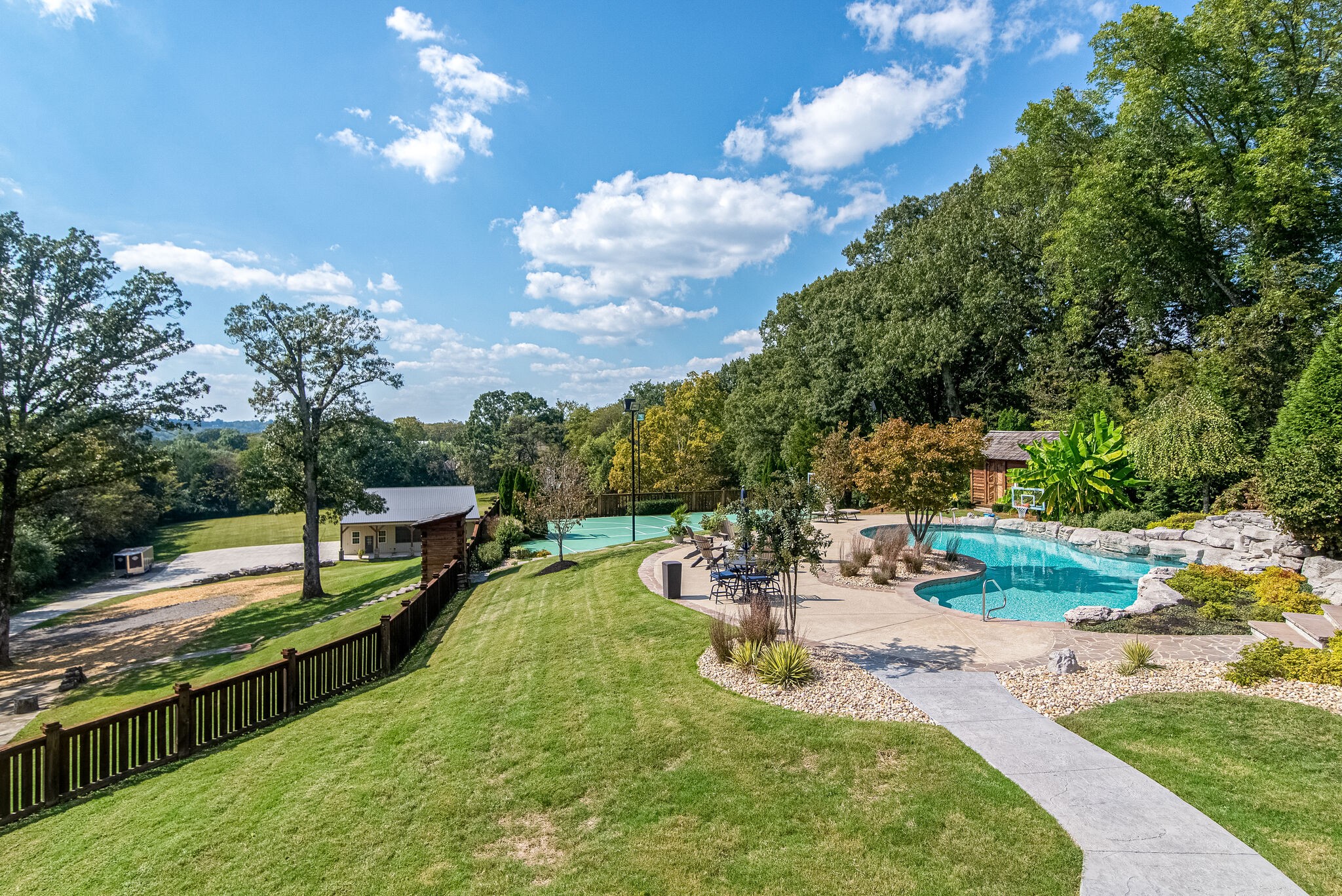 297 Vanderbilt Road Mount Juliet, TN 37122 - Photo 18 of 50 a view of a swimming pool with a patio and a yard
