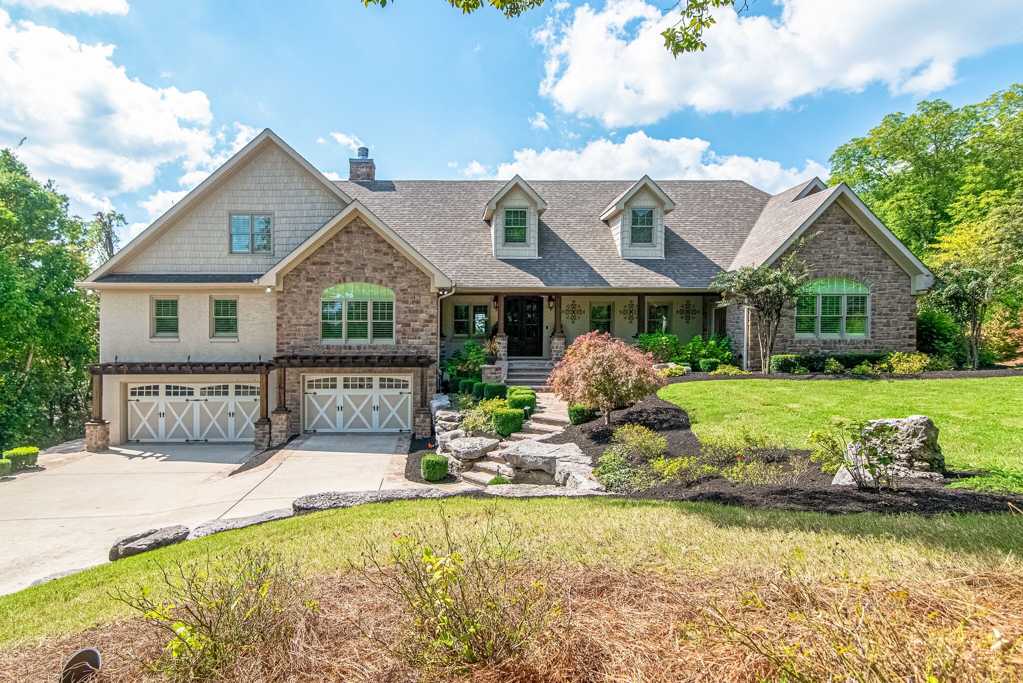 297 Vanderbilt Road Mount Juliet, TN 37122 - Photo 3 of 50 a front view of a house with garden
