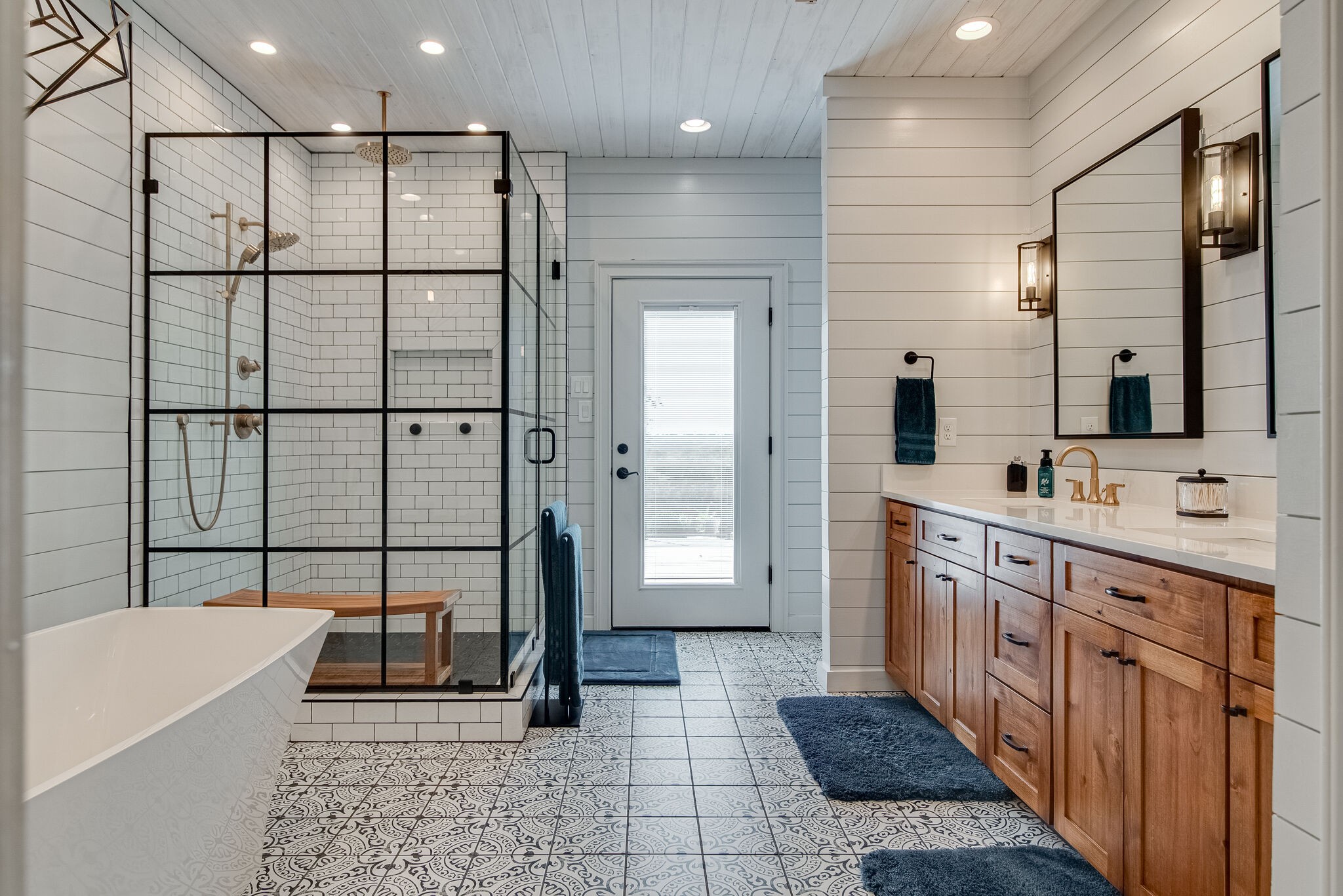 297 Vanderbilt Road Mount Juliet, TN 37122 - Photo 21 of 50 a bathroom with a double vanity sink a mirror and a bathtub