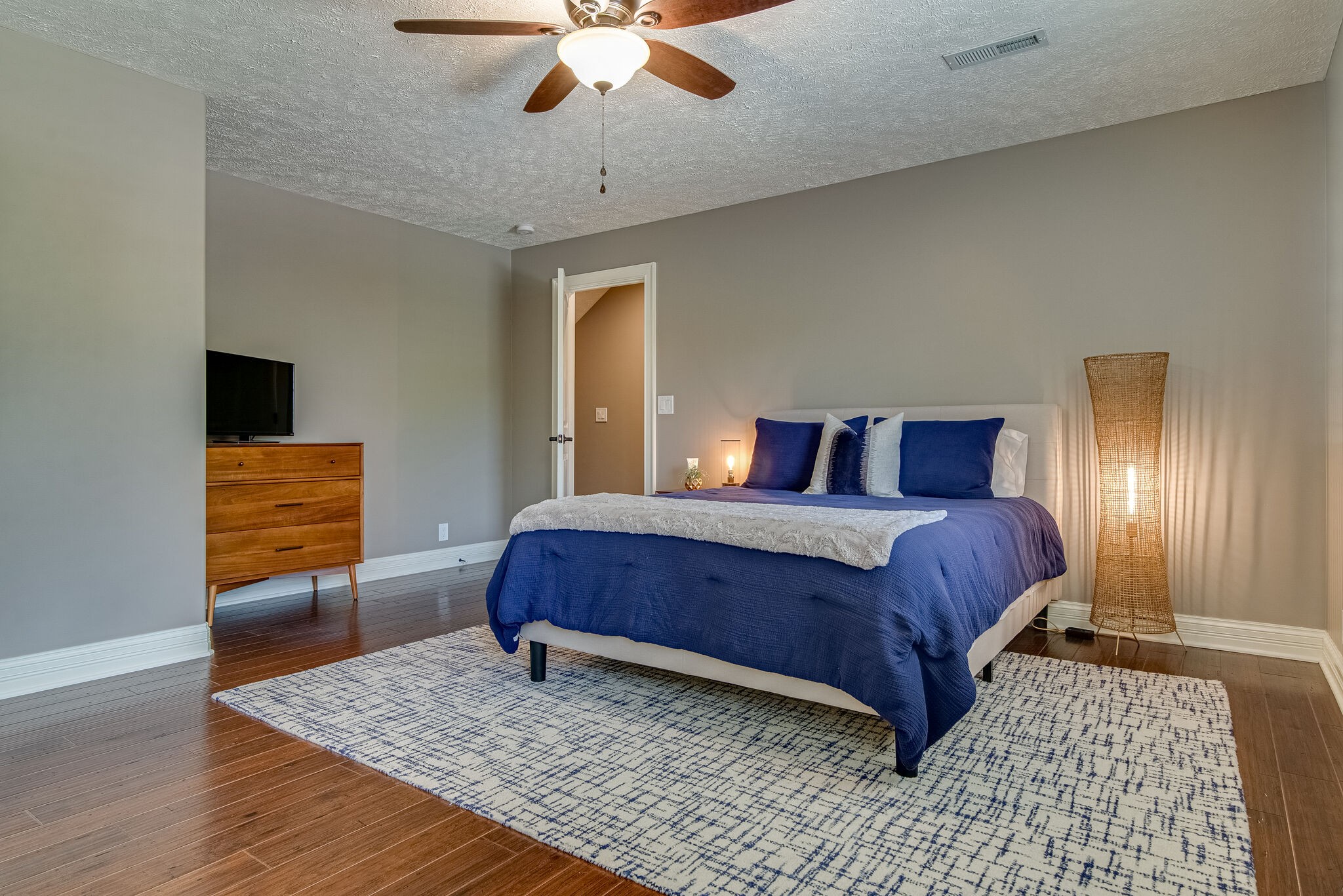 297 Vanderbilt Road Mount Juliet, TN 37122 - Photo 30 of 50 a bedroom with a bed and wooden floor
