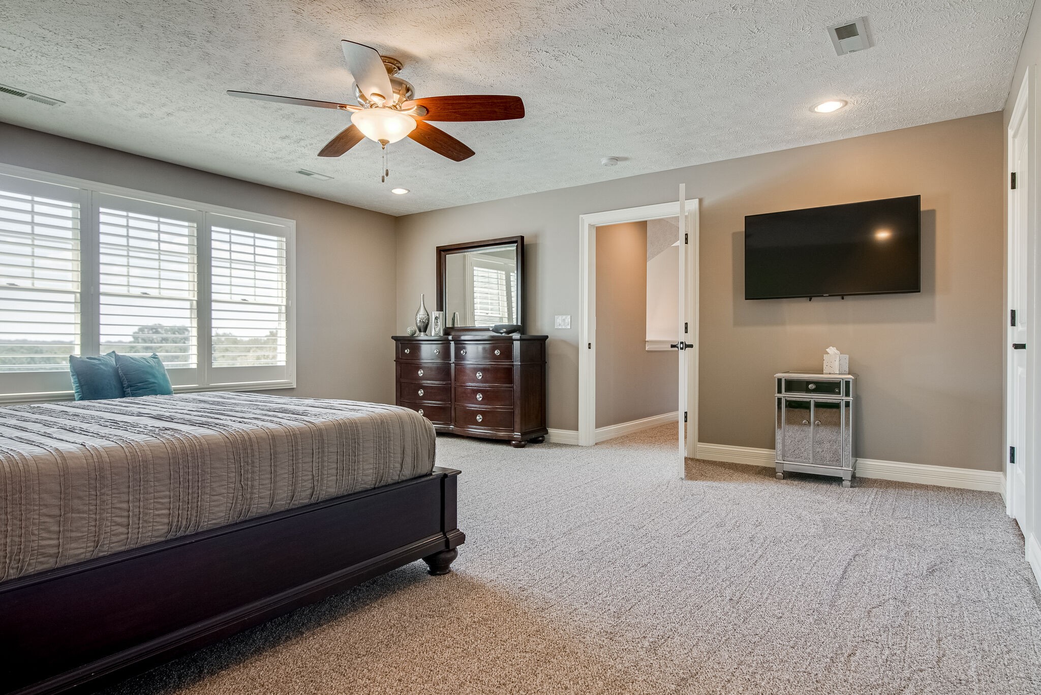 297 Vanderbilt Road Mount Juliet, TN 37122 - Photo 37 of 50 a spacious bedroom with a bed and a flat screen television