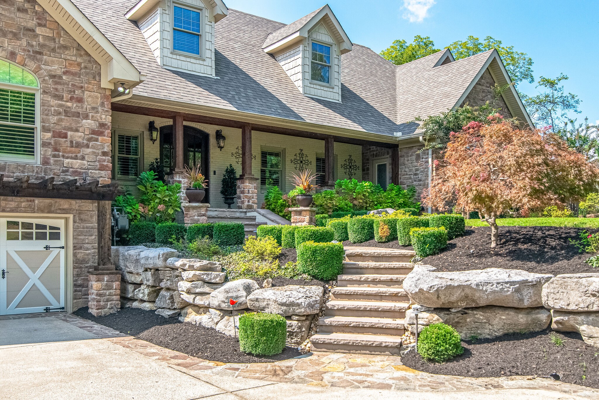 297 Vanderbilt Road Mount Juliet, TN 37122 - Photo 5 of 50 a front view of a house with a garden and plants