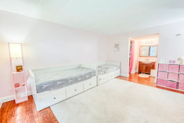 a white toilet sitting next to a bath tub