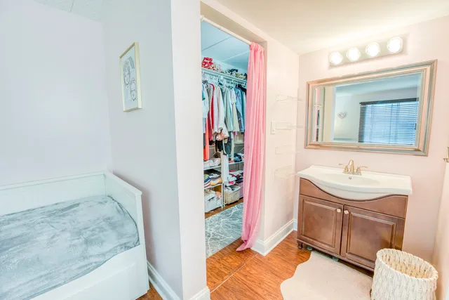 a bathroom with a sink a vanity and a mirror