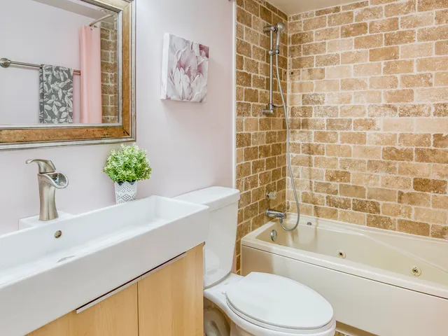 a bathroom with a sink a toilet and a bathtub