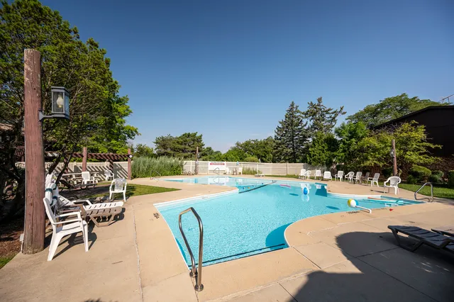a view of a swimming pool with a lounge chair