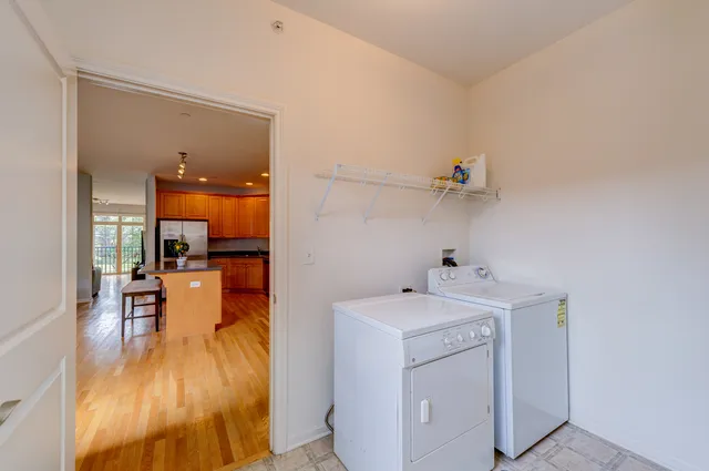 a view of a dining area with furniture and a chandelier
