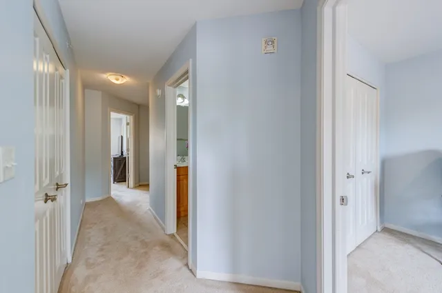 a bedroom with a bed lamp and window