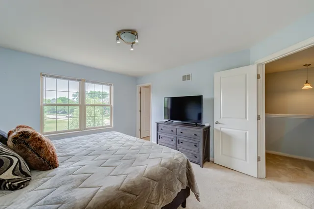 a bathroom with a double vanity sink toilet and shower