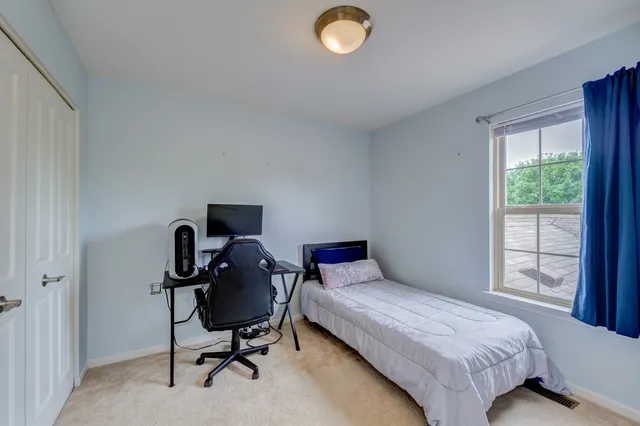 a view of a room with wooden walls