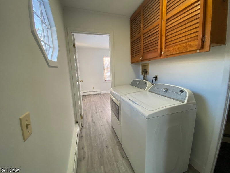 31 Kiel Avenue Butler, NJ 07405 - Photo 12 of 16 a utility room with dryer and washer