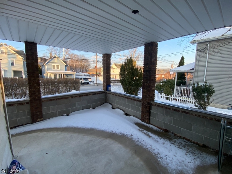 31 Kiel Avenue Butler, NJ 07405 - Photo 16 of 16 a view of a porch with furniture and front door