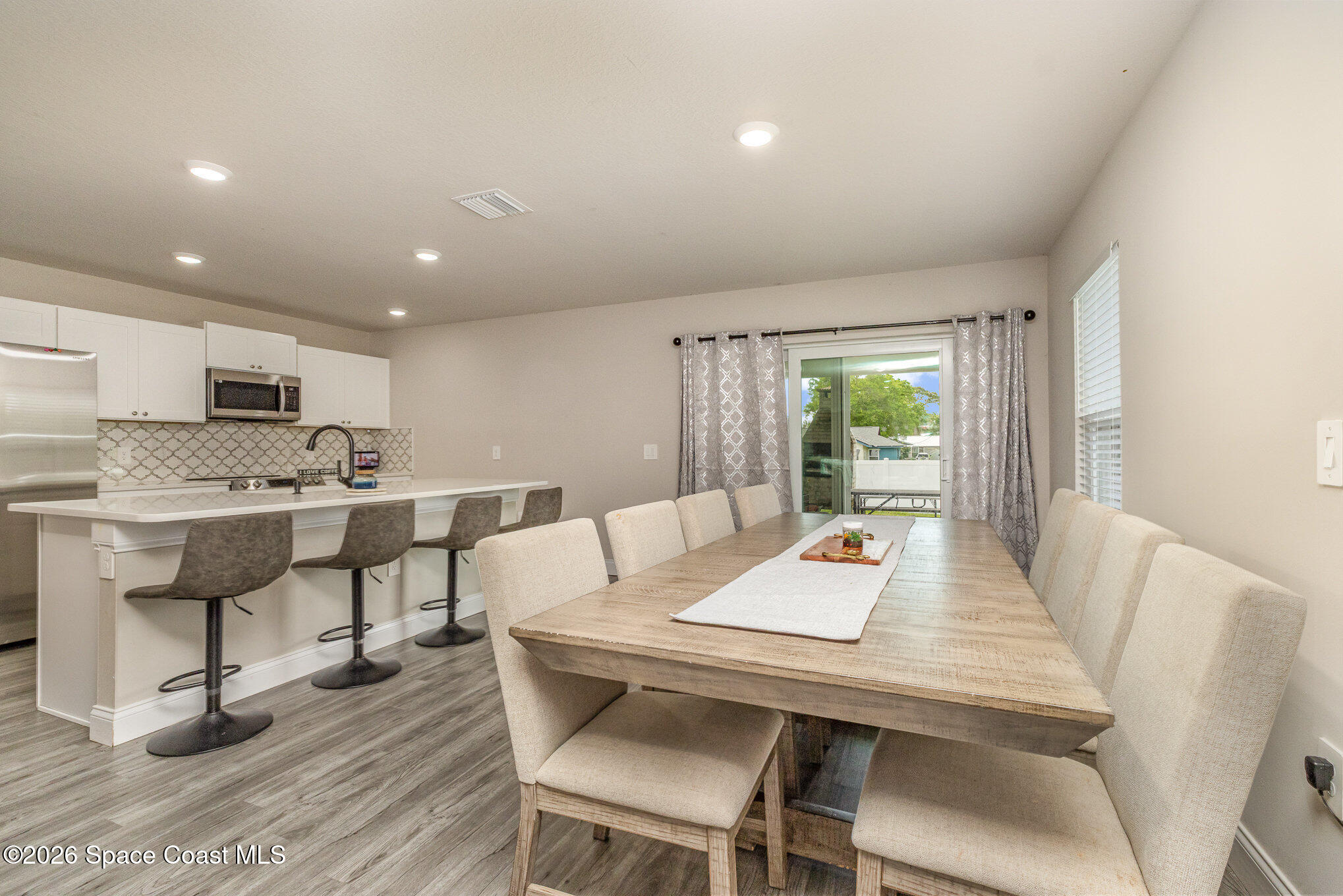 866 Carnival Road Southeast Palm Bay, FL 32909 - Photo 11 of 28 a workspace with furniture and window