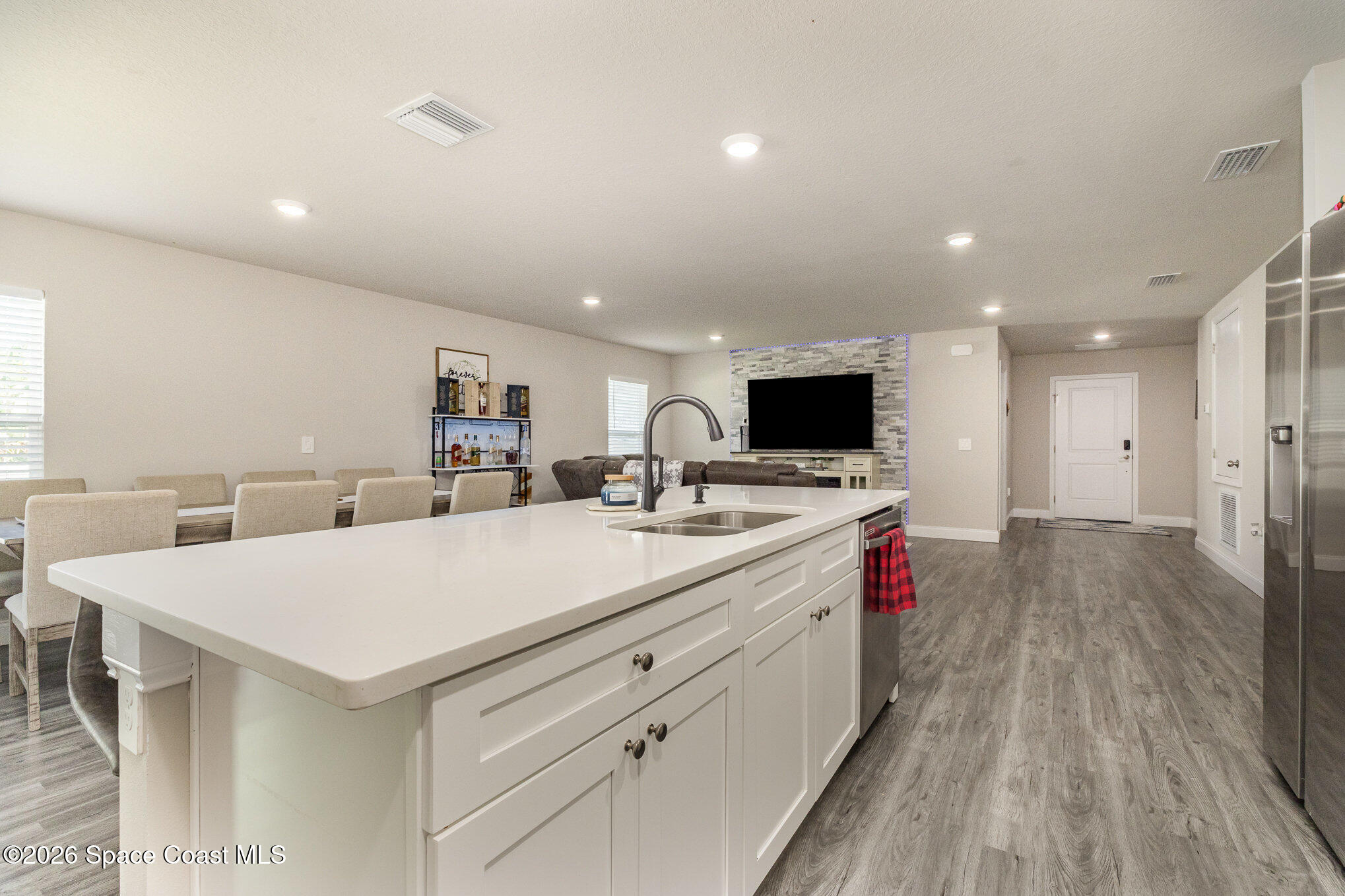 866 Carnival Road Southeast Palm Bay, FL 32909 - Photo 13 of 28 a large white kitchen with a stove and a refrigerator
