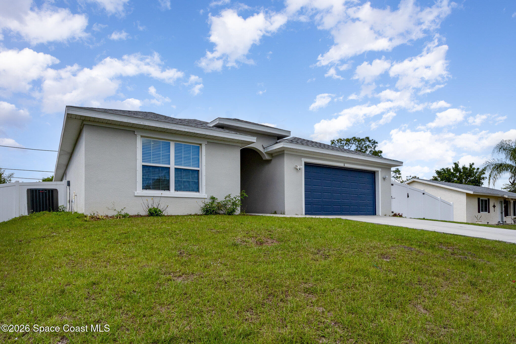 866 Carnival Road Southeast Palm Bay, FL 32909 - Photo 3 of 28 a view of a house with a yard