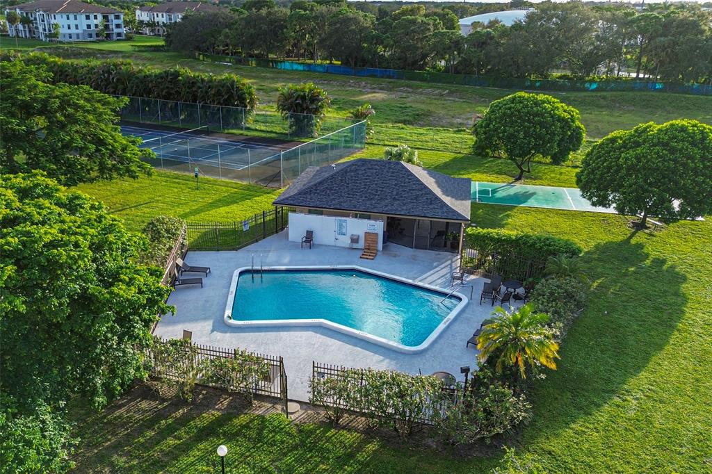 9500 Southwest 3rd Street, Unit 248 Boca Raton, FL 33428 - Photo 35 of 47 an aerial view of a house with pool garden and lake view