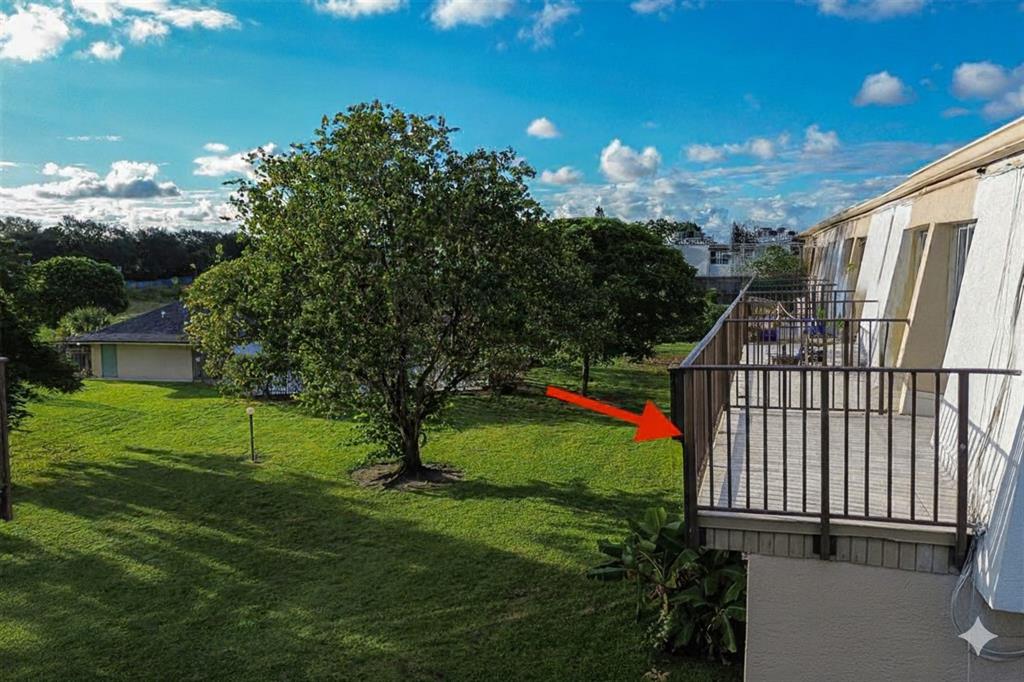 9500 Southwest 3rd Street, Unit 248 Boca Raton, FL 33428 - Photo 37 of 47 a view of a garden with a tree in the background