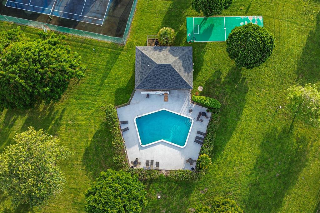 9500 Southwest 3rd Street, Unit 248 Boca Raton, FL 33428 - Photo 41 of 47 a view of a house with a yard and a garden