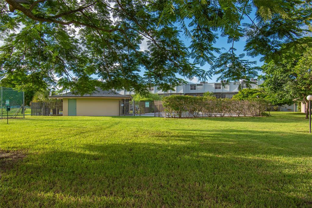 9500 Southwest 3rd Street, Unit 248 Boca Raton, FL 33428 - Photo 44 of 47 a view of a house with a yard