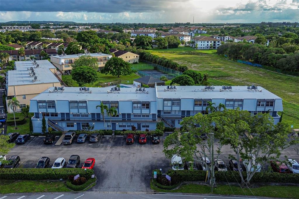 9500 Southwest 3rd Street, Unit 248 Boca Raton, FL 33428 - Photo 47 of 47 a view of a chairs and table in a yard
