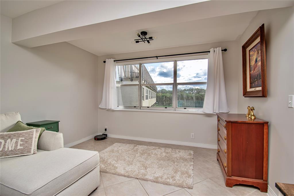 9500 Southwest 3rd Street, Unit 248 Boca Raton, FL 33428 - Photo 6 of 47 a living room with furniture and a window