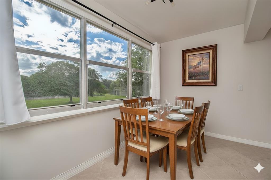 9500 Southwest 3rd Street, Unit 248 Boca Raton, FL 33428 - Photo 7 of 47 a dining room with furniture and window