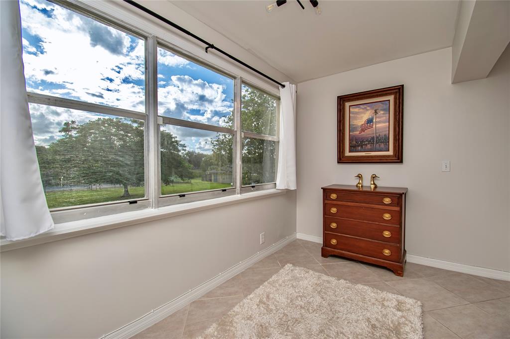 9500 Southwest 3rd Street, Unit 248 Boca Raton, FL 33428 - Photo 8 of 47 a room with a window and a dresser