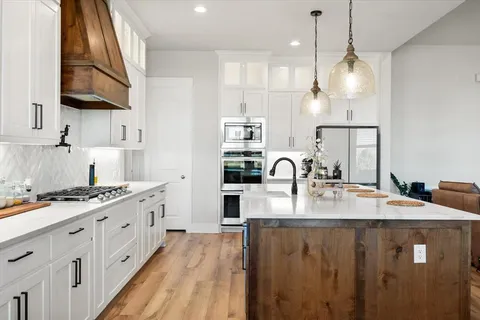 a kitchen with a table and chairs
