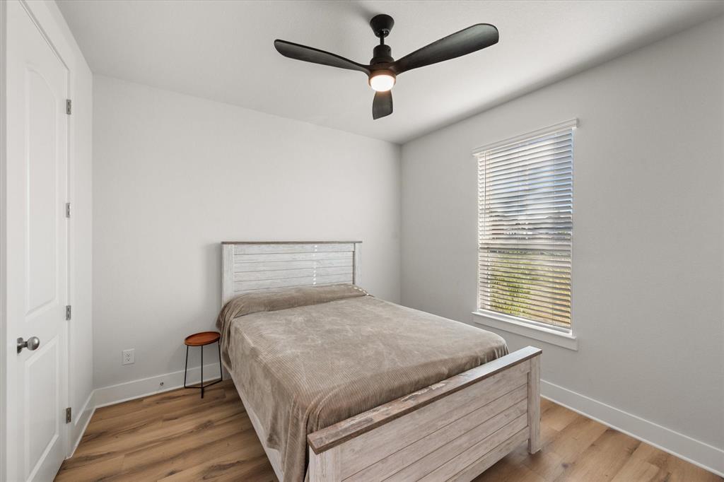 8221 David Lane Midlothian, TX 76065 - Photo 22 of 34 Bedroom with light wood finished floors and a ceiling fan