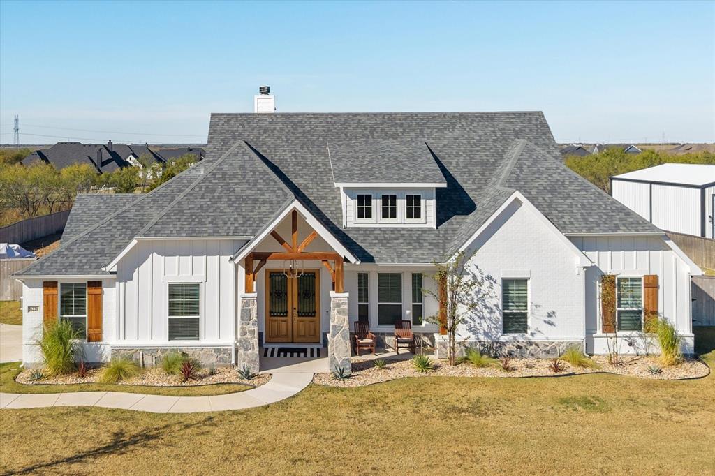 8221 David Lane Midlothian, TX 76065 - Photo 26 of 34 Modern farmhouse featuring board and batten siding, a shingled roof, a front lawn, a chimney, and french doors