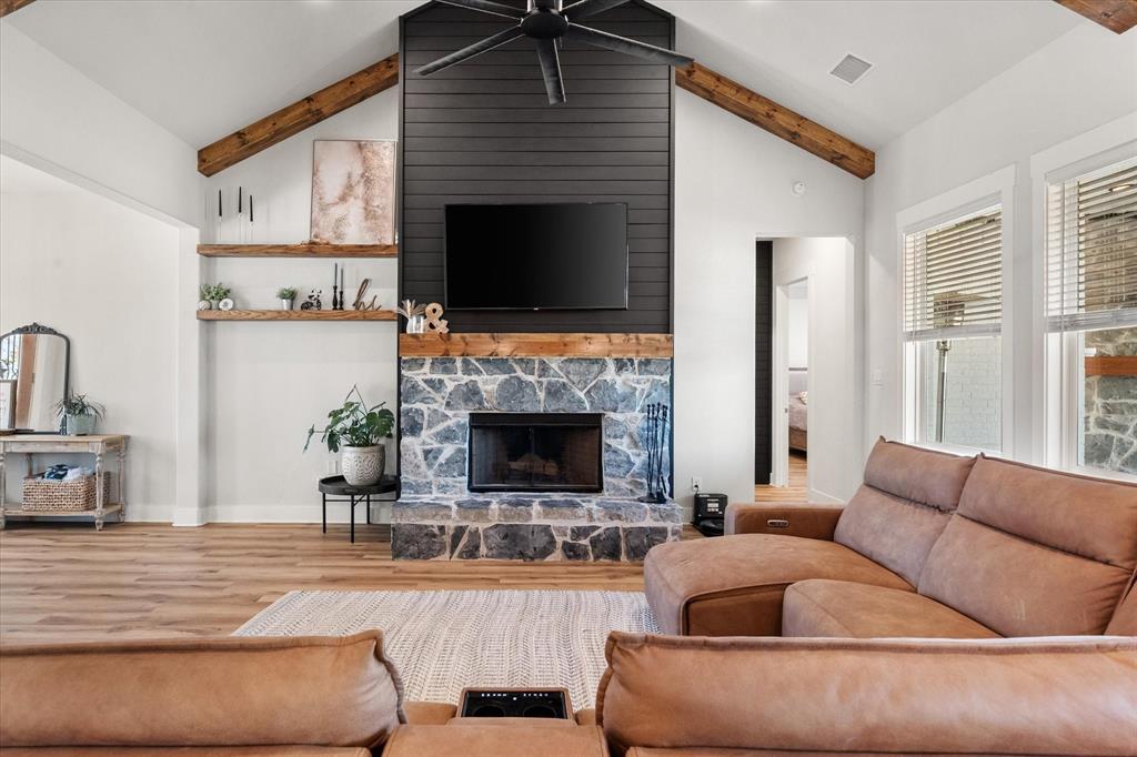 8221 David Lane Midlothian, TX 76065 - Photo 4 of 34 a living room with furniture a fireplace and a flat screen tv