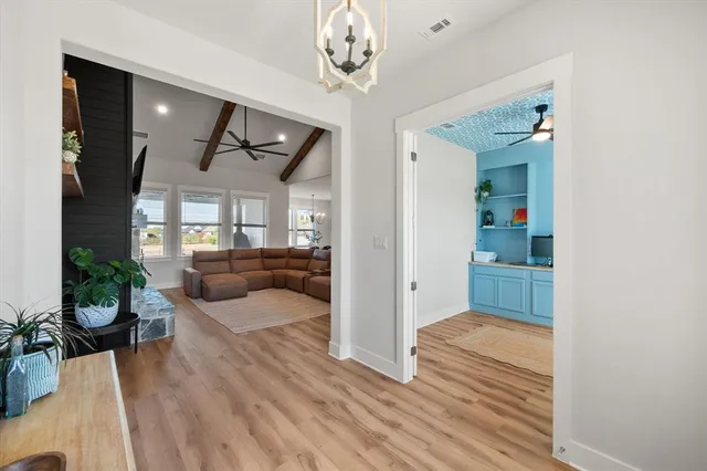 a bedroom with furniture and a wooden floor