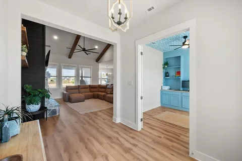 a bedroom with furniture and a wooden floor