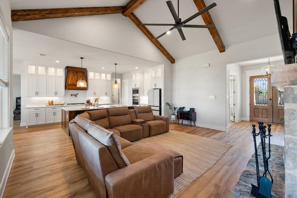 8221 David Lane Midlothian, TX 76065 - Photo 10 of 34 Living area featuring high vaulted ceiling, light wood-type flooring, beam ceiling, ceiling fan, and recessed lighting