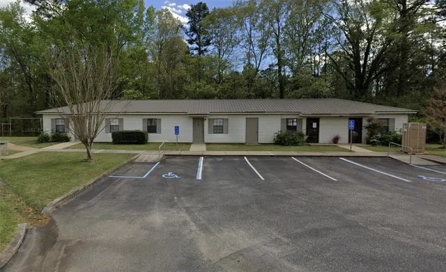 a house with trees in the background