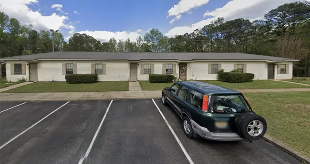a view of a car parked in front of a house