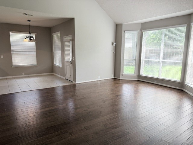 20030 Castlegreen Drive Spring, TX 77388 - Photo 9 of 23 an empty room with wooden floor and windows